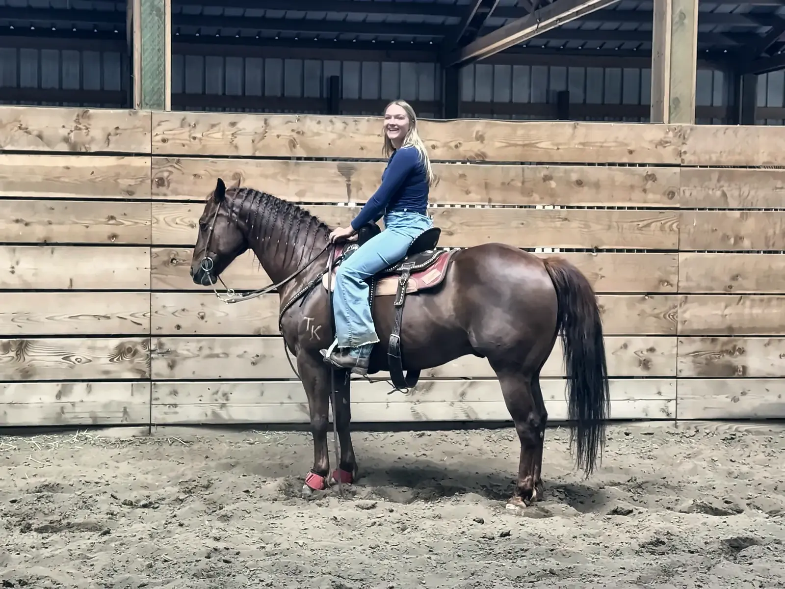 A rider sitting tall on a bay horse